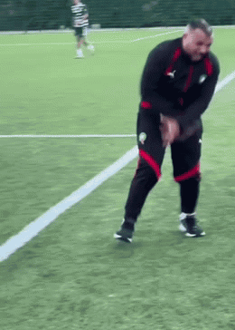 Man In Black Jacket And Red Shorts On Soccer Field GIF