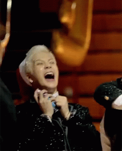 Man in Black Jacket and Tie Laughing