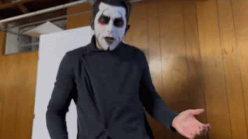 Man in Black Jacket and White Face Paint