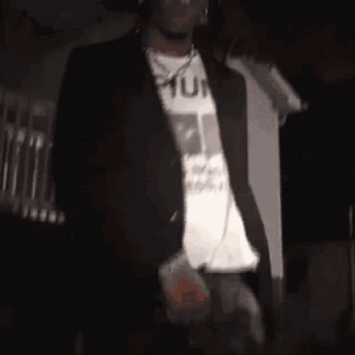 Man in Black Jacket and White Shirt in Dark