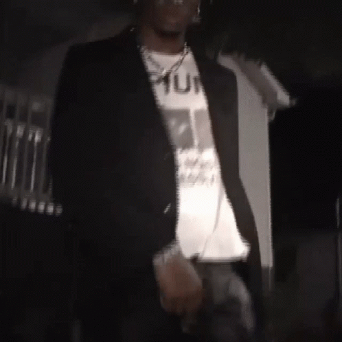Man in Black Jacket and White T-Shirt Saying Punk