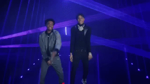 Man In Black Jacket Facing Blue Lights GIF