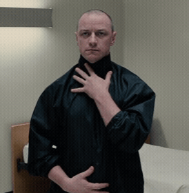 Man in Black Jacket Hand on Chest