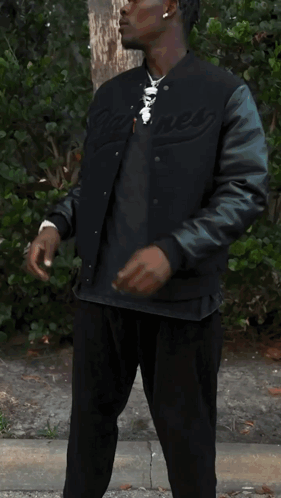 Man In Black Jacket Holding Bag Of Ice Cream GIF