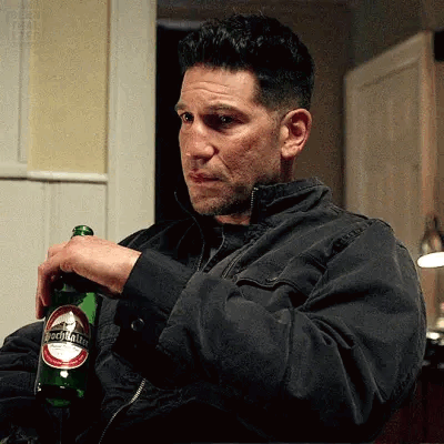 Man in Black Jacket Holding Benjamin Beer