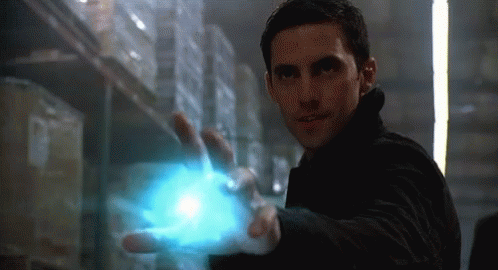 Man In Black Jacket Holding Blue Object GIF