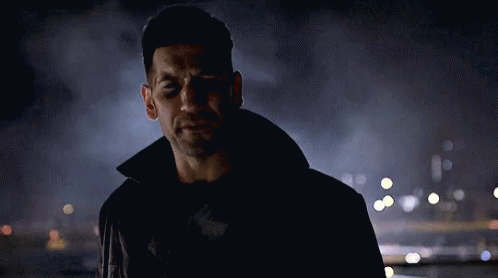 Man in Black Jacket in City at Night