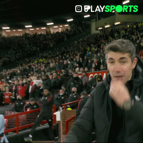 Man In Black Jacket In Front Of Crowd GIF