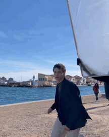 Man in Black Jacket on Beach
