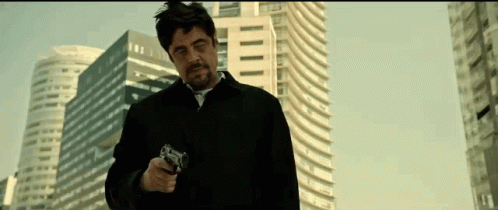 Man in Black Jacket Pointing Gun