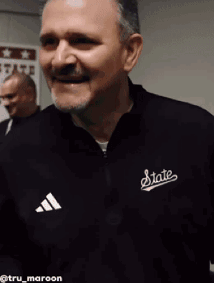 Man in Black Jacket Saying State
