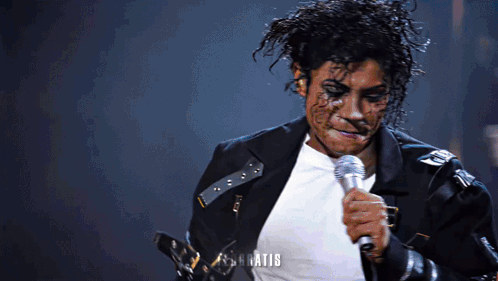 Man In Black Jacket Singing Into Microphone What GIF