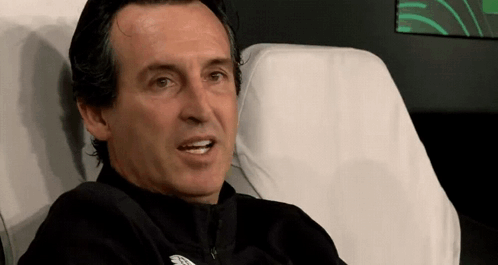 Man In Black Jacket Sitting In Chair With White Cushion GIF