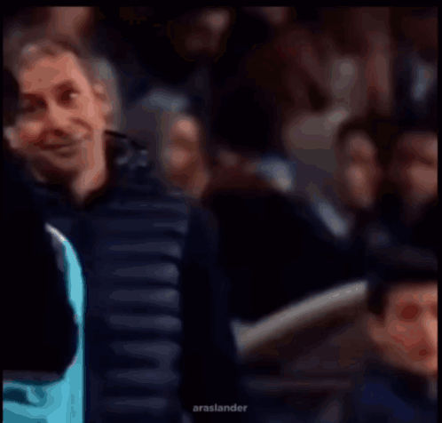 Man in Black Jacket Smiling at Crowd Arashlander