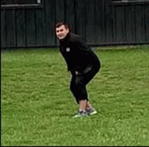 Man in Black Jacket Squatting