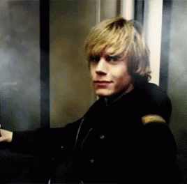 Man in Black Jacket Standing in Elevator