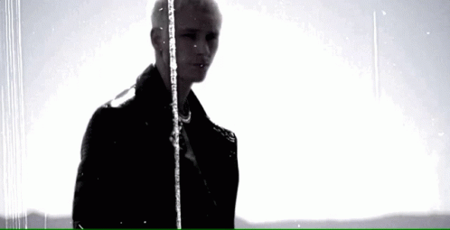 Man in Black Jacket Standing in Rain