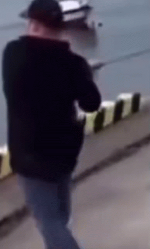Man In Black Jacket Walking GIF