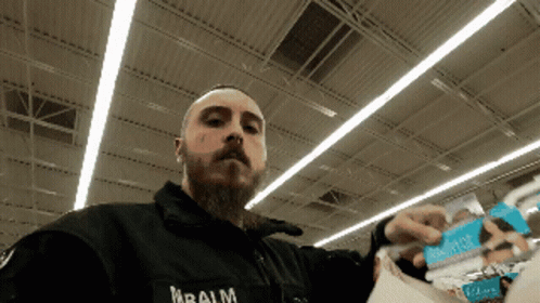 Man in Black Jacket With Balm Text