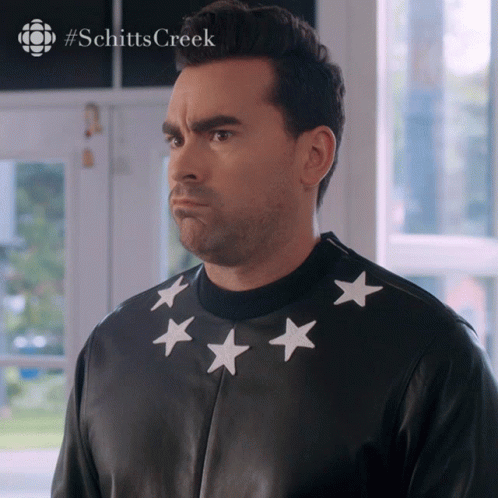 Man In Black Jacket With White Stars On Collar GIF