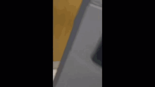Man In Black Jumpsuit At Sink GIF