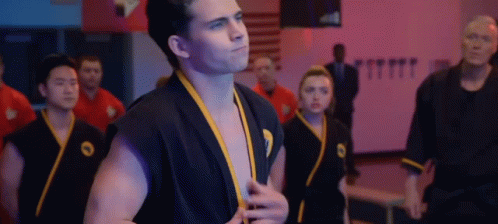 Man in Black Karate Uniform in Gym