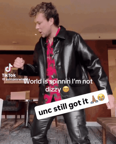 Man in Black Leather Jacket Dancing World is Spinnin I'm Not Dizzy