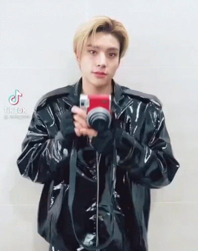 Man in Black Leather Jacket Holding Camera