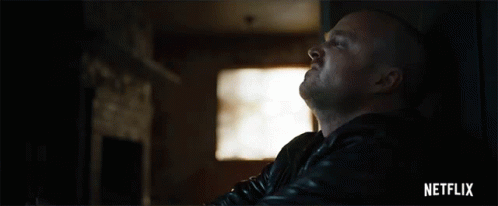 Man in Black Leather Jacket Looking Up