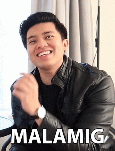 Man in Black Leather Jacket Smiling Malamig