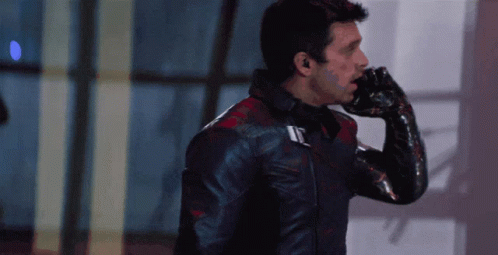 Man in Black Leather Jacket Talking on Cell Phone
