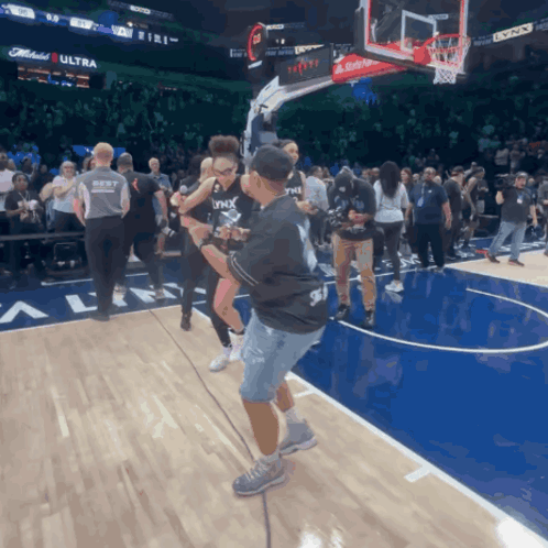 Man In Black Lynx Shirt On Basketball Court GIF