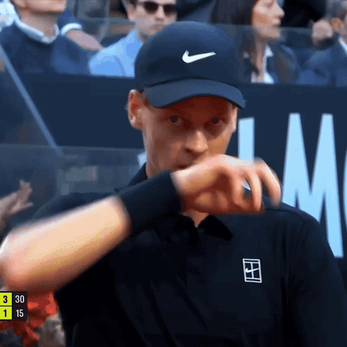 Man In Black Nike Hat Checking Watch GIF