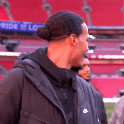 Man in Black Nike Jacket at Stadium