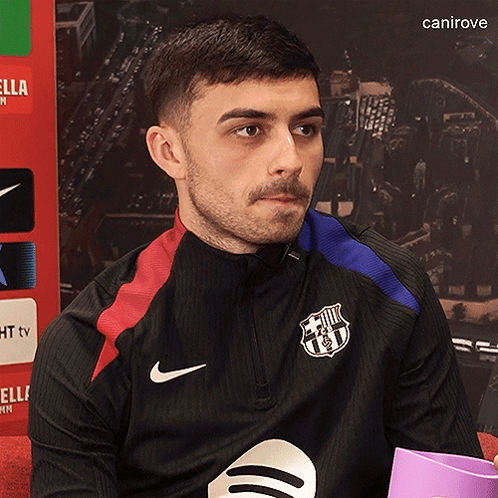 Man in Black Nike Jacket with FCB Logo