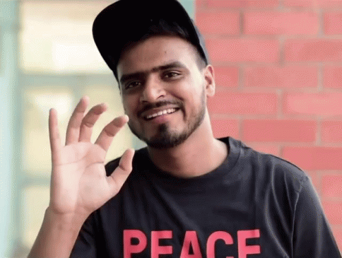 Man in Black Peace Shirt Smiling