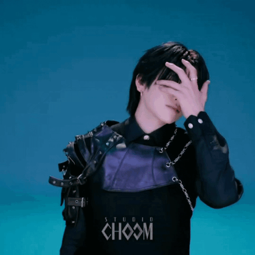 Man in Black Purple Covering Face at Studio Choom Logo