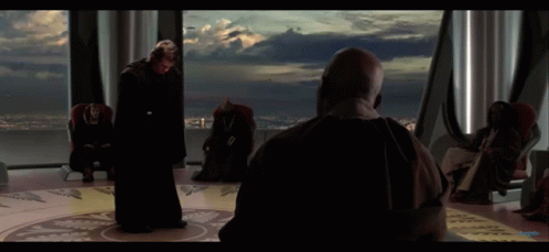 Man in Black Robe Standing