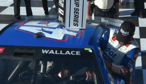 Man In Black Root Hat In Front Of Race Car GIF