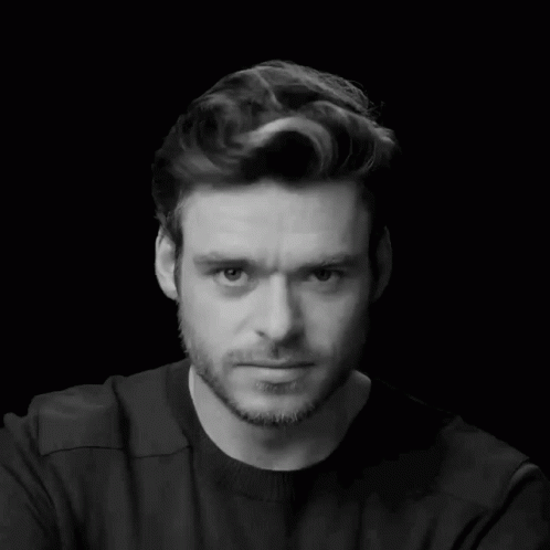 Man In Black Shirt And Beard Looking Down GIF