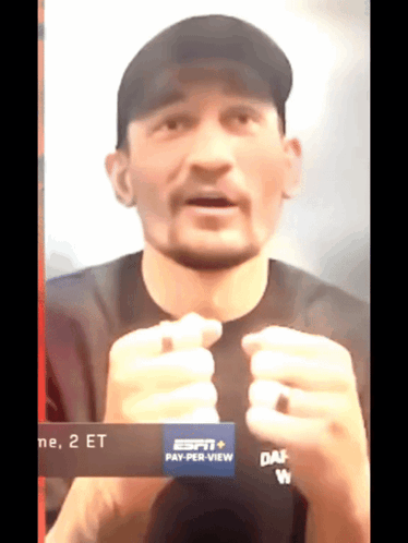 Man in Black Shirt and Black Hat Saying Pay Per View