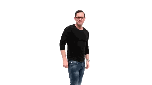 Man in Black Shirt and Jeans Smiling