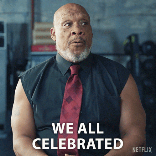 Man in Black Shirt and Red Tie Says We All Celebrated