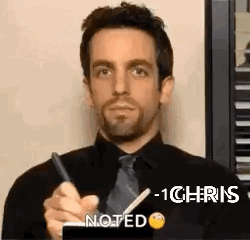 Man in Black Shirt and Tie Writing