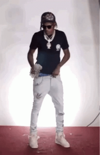 Man in Black Shirt and White Jeans Dancing