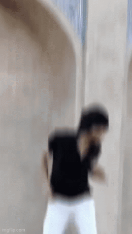 Man in Black Shirt and White Pants Dancing
