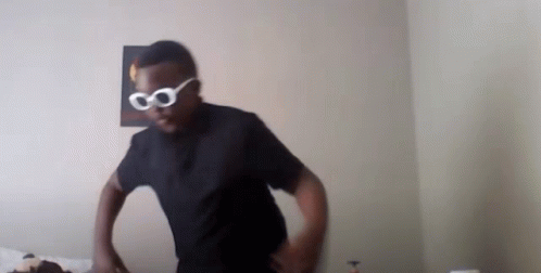 Man in Black Shirt and White Sunglasses
