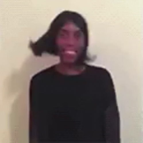 Man in Black Shirt and Wig Smiling
