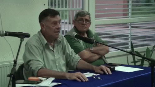 Man In Black Shirt And Woman In Pink Costume GIF