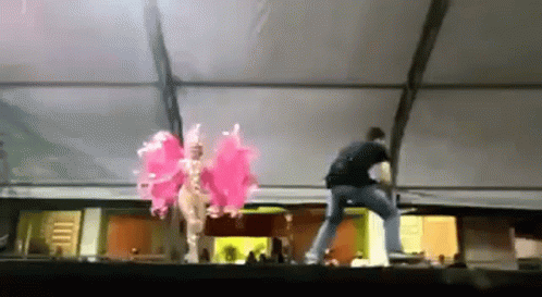 Man In Black Shirt And Woman In Pink GIF